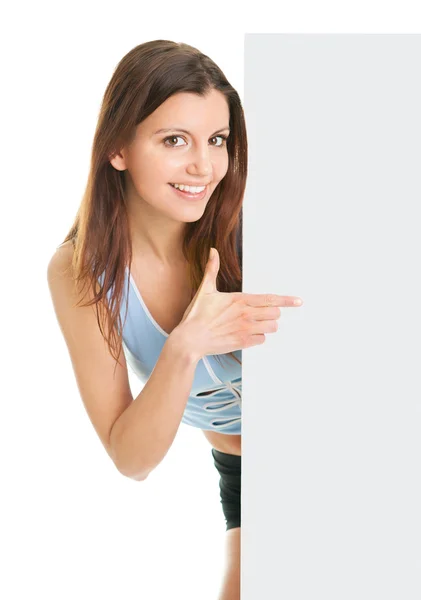 Фитнес-женщина представляет пустой плакат — стоковое фото