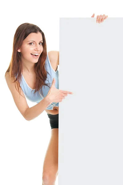 Mulher fitness apresentando placard vazio — Fotografia de Stock