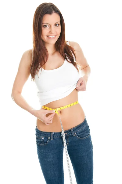 Beautiful woman measuring waist — Stock Photo, Image
