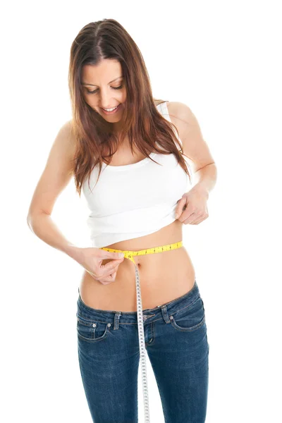 Beautiful woman measuring waist — Stock Photo, Image