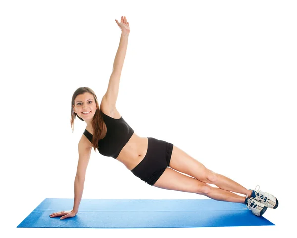 Fitness woman doing aerobics on gym mat — Stock Photo, Image