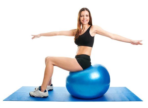 Fitness woman stretshing on fitness ball — Stok fotoğraf