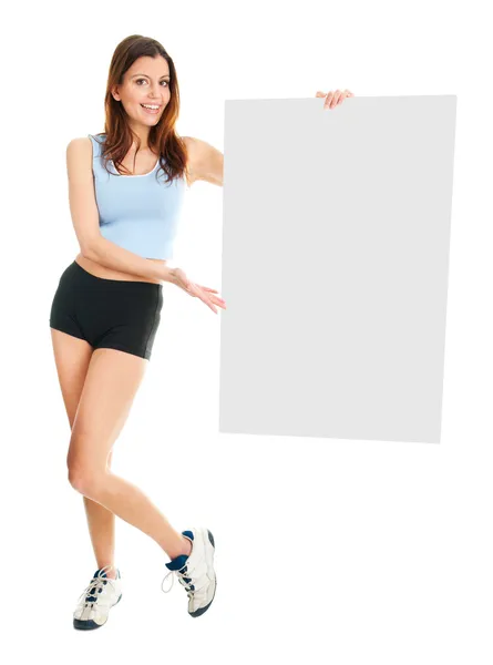 Fitness woman presenting empty placard — Stock Photo, Image