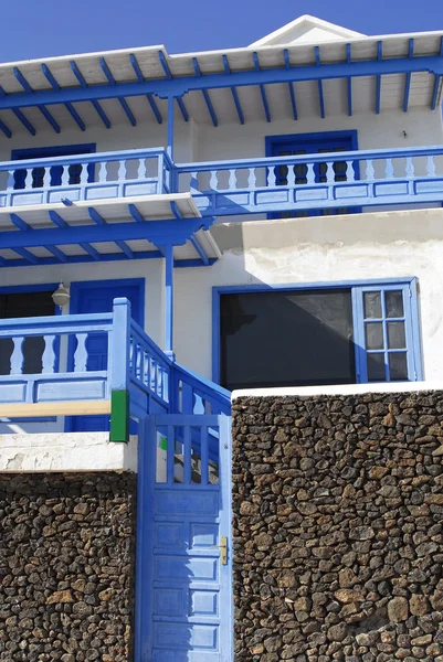White villa with blue balcony — Stock Photo, Image