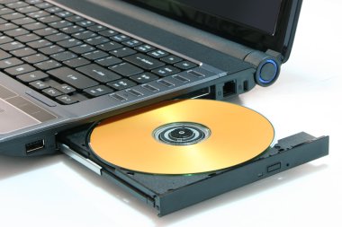 Laptop and DVD isolated on white clipart