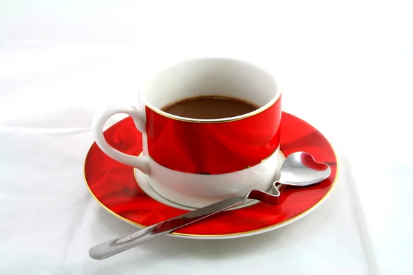 stock image Cup of coffee with spoon on white background