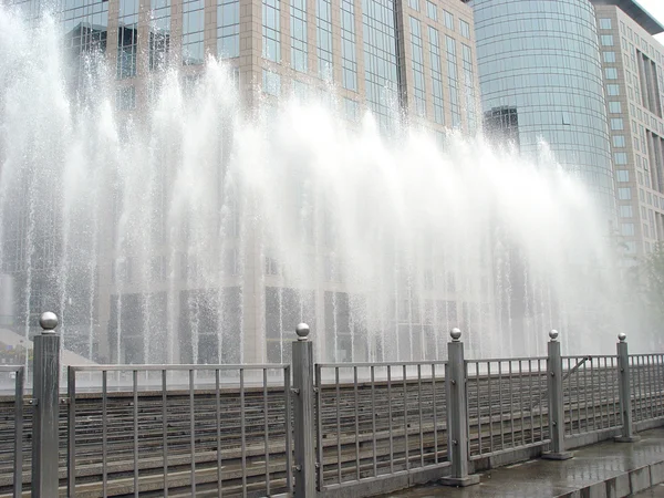 stock image Fountain and Office building