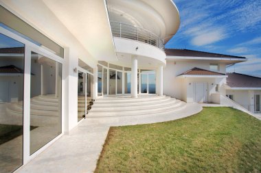 Modern house exterior, large and expensive house architecture. clipart