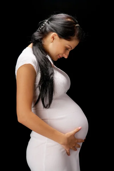 Siyah arka plan üzerine hamile — Stok fotoğraf
