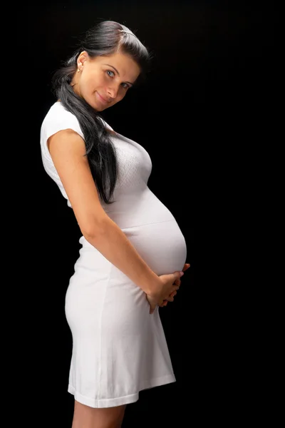 怀孕在黑色背景上 — 图库照片
