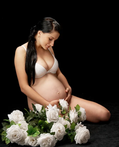Těhotná s růží — Stock fotografie