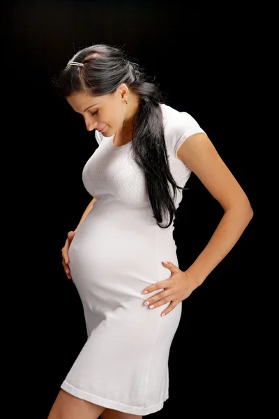 Siyah arka plan üzerine hamile — Stok fotoğraf