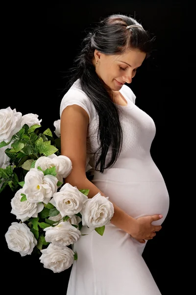 Těhotná s růží — Stock fotografie