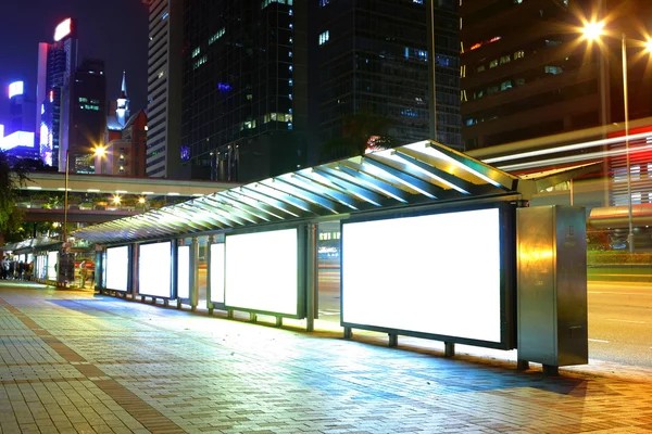Blank billboard on bus stop at night — Stock Photo, Image
