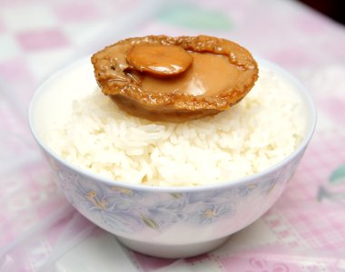 Home made cooked abalone on rice clipart