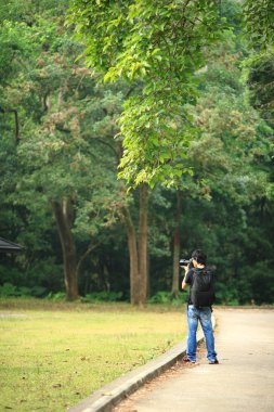 Photographer in country side clipart