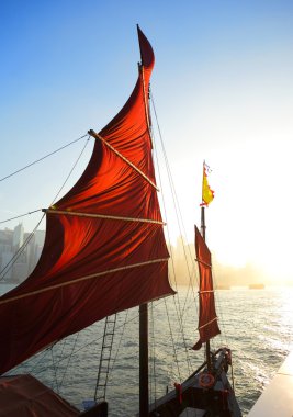 Sailboat flag in Hong Kong harbor clipart