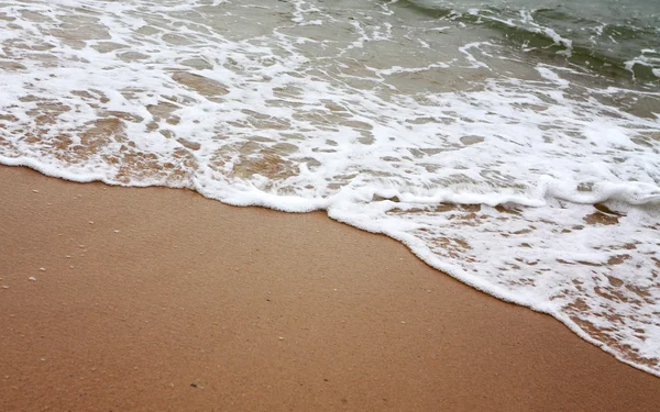Homokos strand víz háttér — Stock Fotó