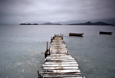 Pier and boat, low saturation clipart