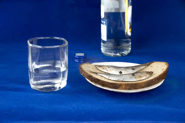 stock image Glass of vodka and sandwich with a sprat