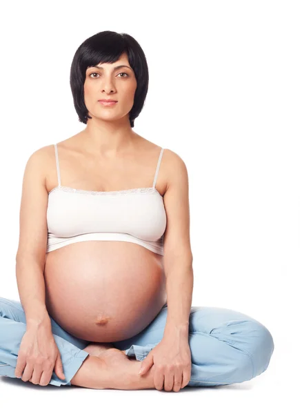 Siedzi kobieta w ciąży — Zdjęcie stockowe