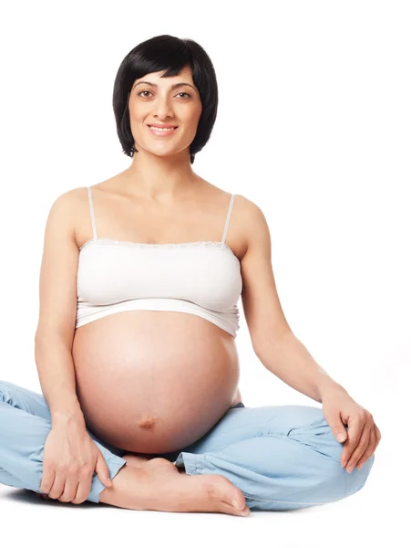 Сидящая беременная женщина Стоковое Изображение