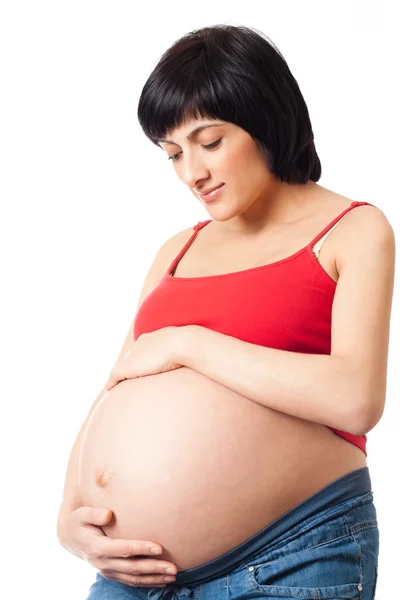 Těhotná žena obejme jeho žaludku — Stock fotografie