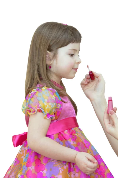 Dziewczyna maluje usta — Zdjęcie stockowe