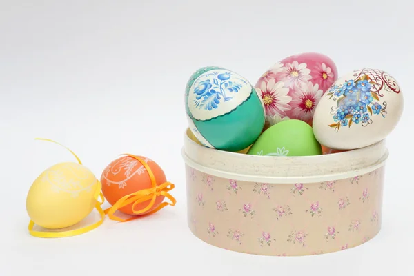 Colour eggs have dropped out of a casket — Stock Photo, Image