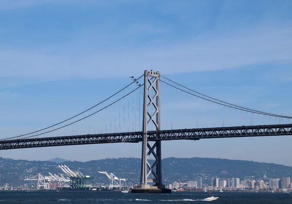 Four Blue Angels fly behind the San Francisco Bay Bridge — Stock Photo, Image