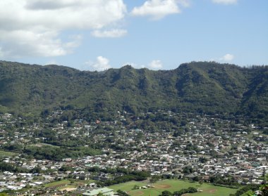 Manoa Valley on the Island of Oahu. Featuring Baseball fields, houses, school and graveyard. clipart