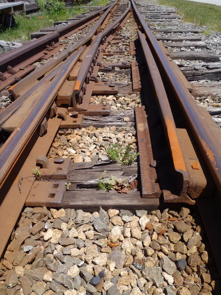 Railroad tracks running into distance with a track switch — Stock Photo, Image