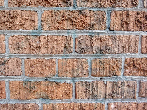 Brick wall cemented together thats has had spray paint removed f — Stock Photo, Image