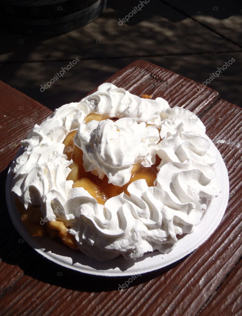 Funnel Cake enjoyed at a picnic table in a park