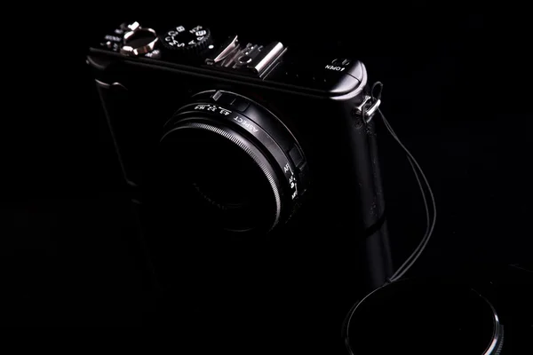 stock image Black digital camera on dark backround