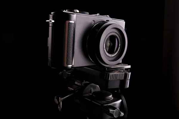 stock image Black digital camera on dark backround