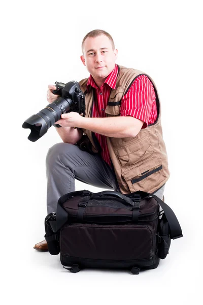 stock image Photographer with digital kamera and zoom lens on white background