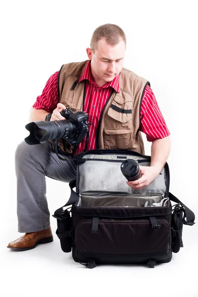 stock image Photographer with digital kamera and zoom lens on white background