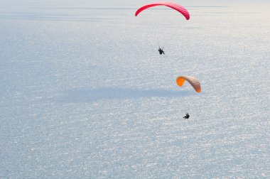 Paragliding over sea clipart