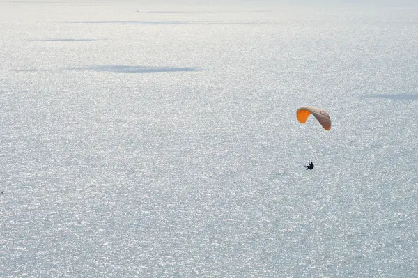 stock image Paragliding over sea