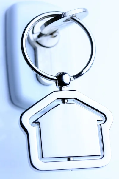 stock image Macro of a lock and key with metal house figure