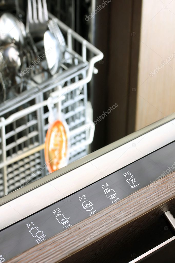 Dishwasher control panel in front of fork and spoon basket