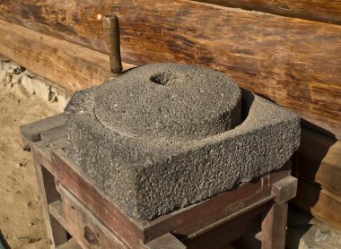 It is well made of stone grinders, which are used for the conversion of grain into flour. clipart