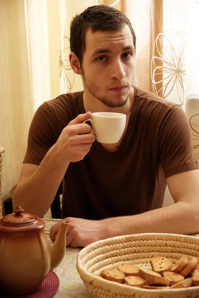 stock image a young guy having a breakfast in the kitchen