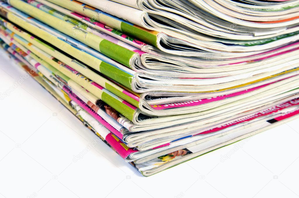 Stack of magazines over white background