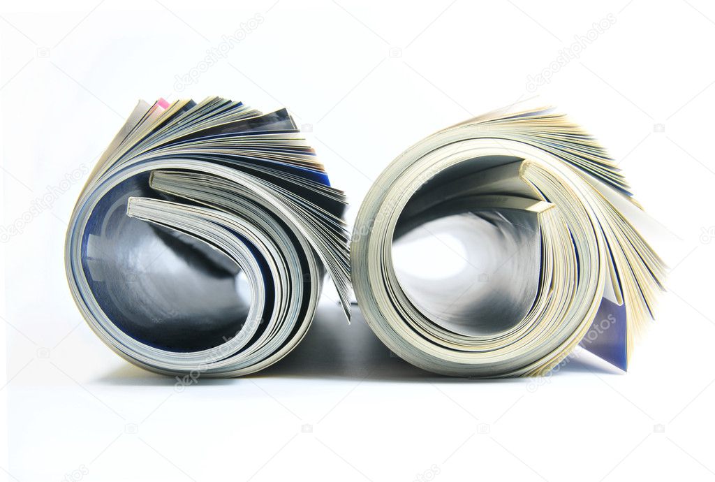 Two rolled up magazines over white background