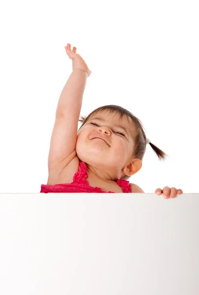 Happy baby hålla whiteboard och når upp — Stockfoto
