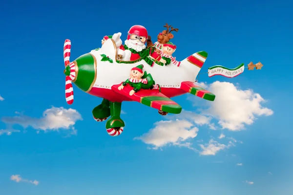 stock image Flying Santa Claus with Elves in Airplane