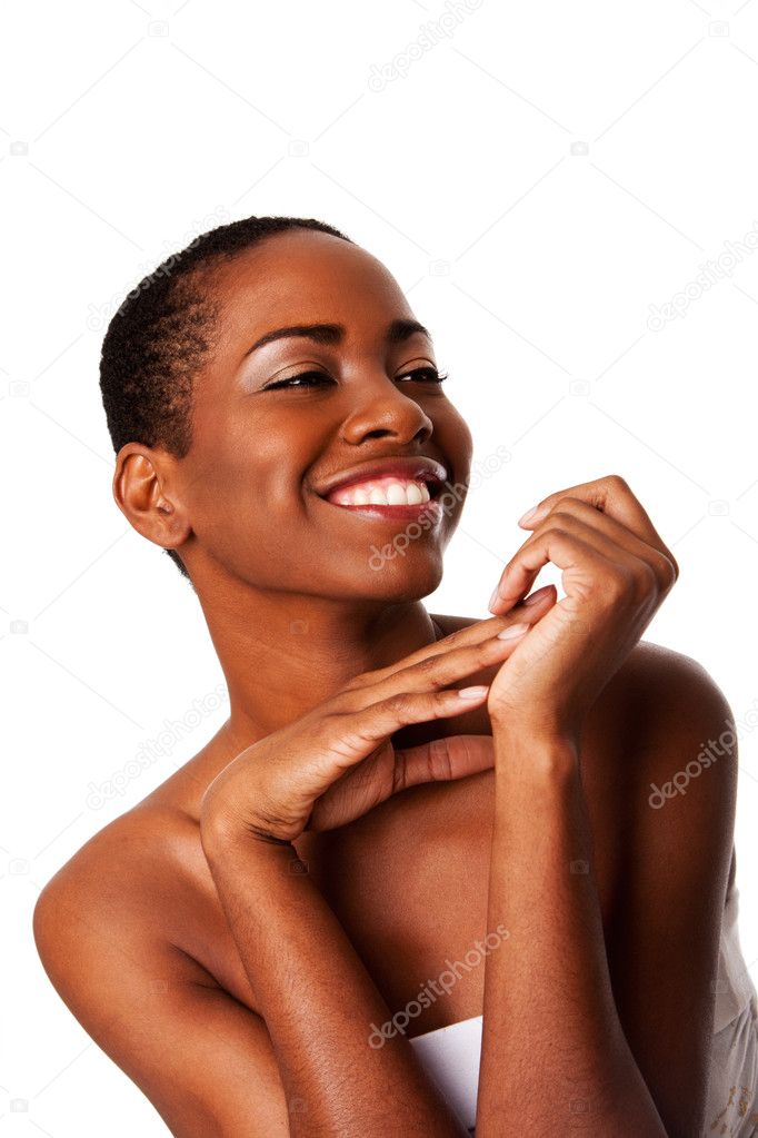 Beautiful happy smiling inspiring African woman with short curly hair and great skin showing teeth, isolated.
