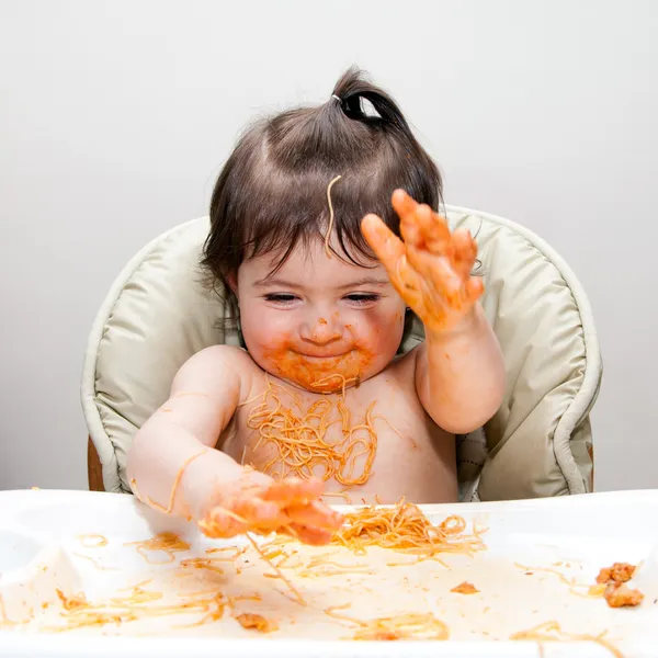 Happy funny messy eater Stock Photo